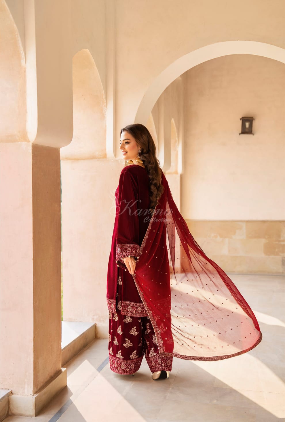 Maroon velvet Pakistani women's long kaftan with plazo side view