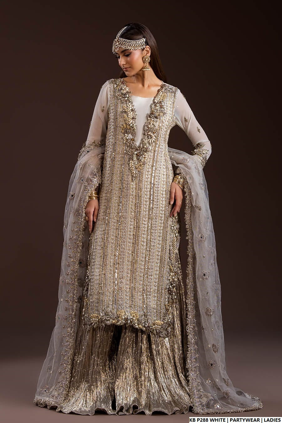 Pakistani women's white velvet embroidered suit full view