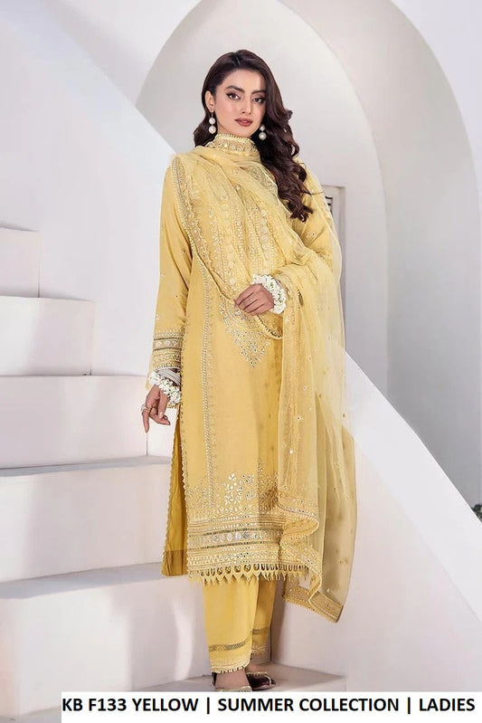 Yellow pure cotton Pakistani women's hand embroidered outfit side view