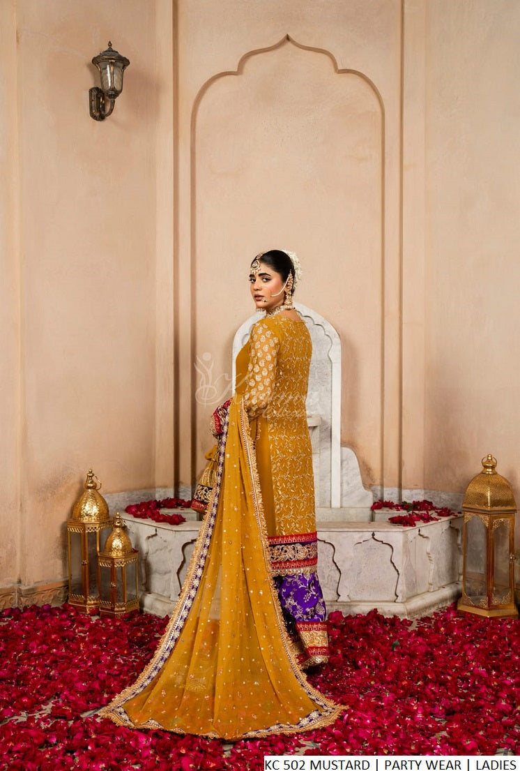 Pakistani women's mustard yellow chiffon short shirt shalwar back view