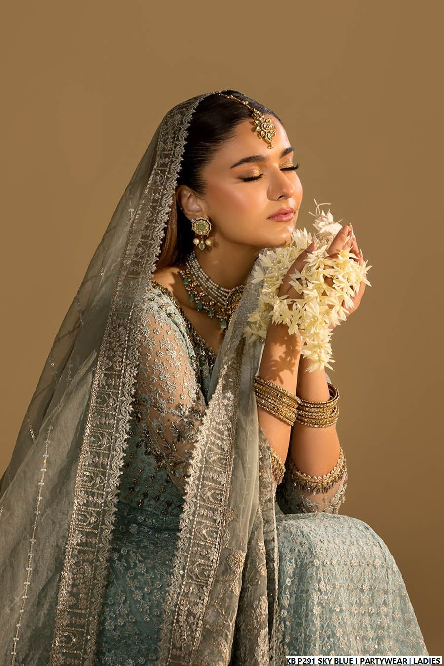 Pakistani women's sky blue velvet embroidered suit detail view