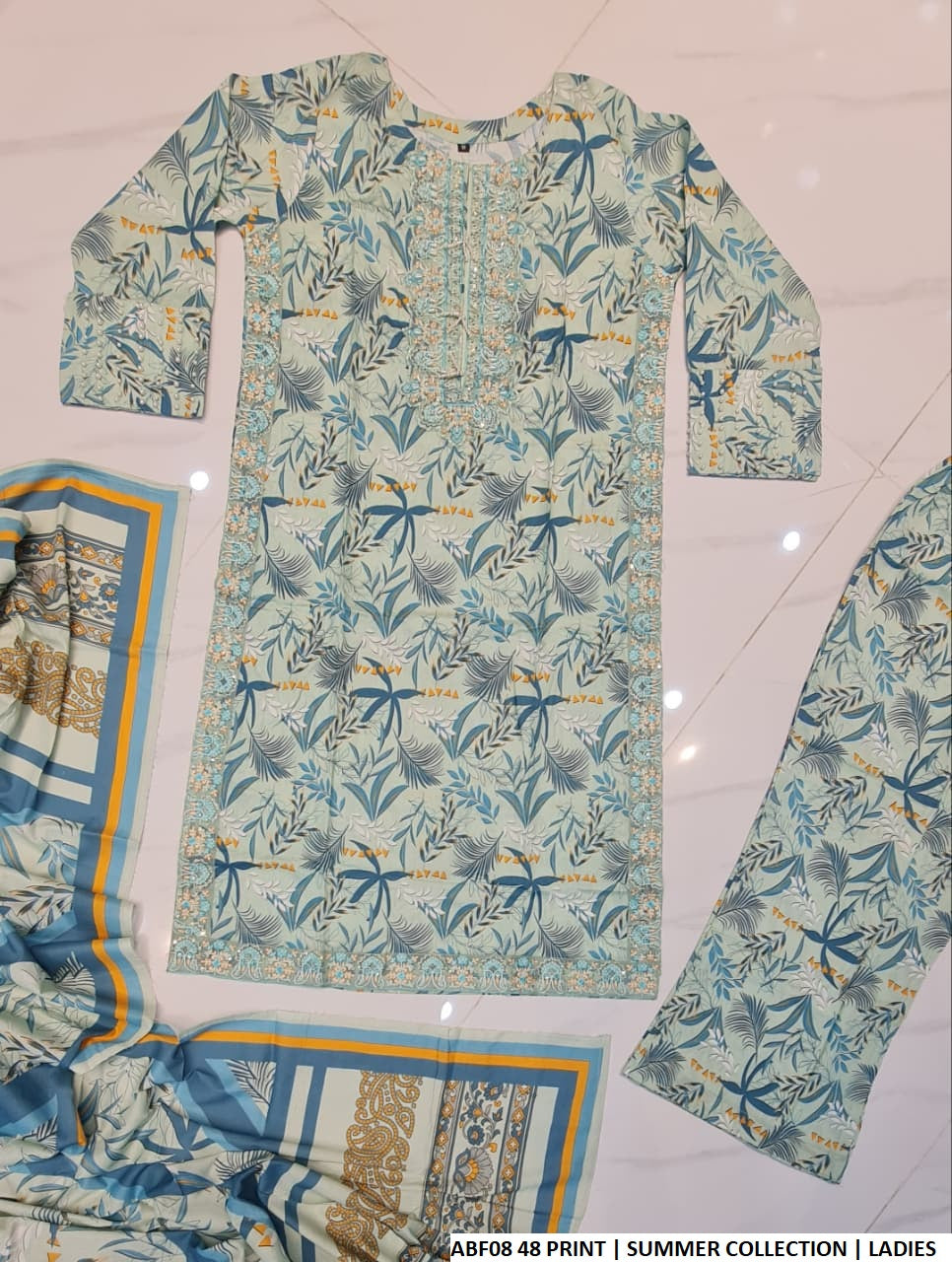 Pakistani women's lawn straight printed shirt bell bottom trouser back view