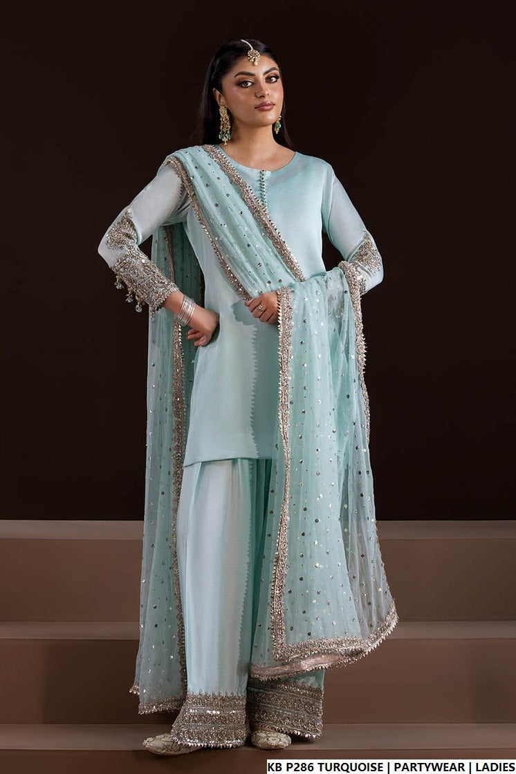 Turquoise hand embroidered Pakistani women's luxury suit side view