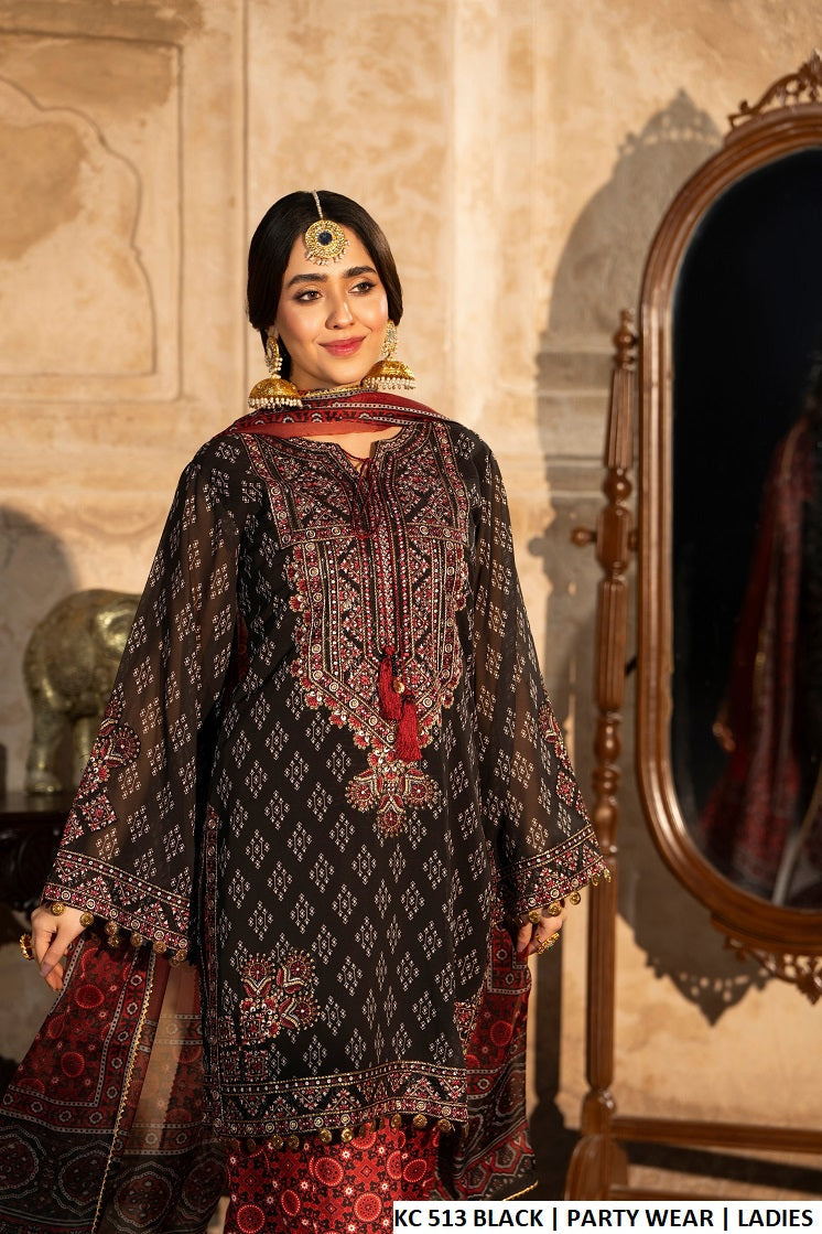 Ebony black sindhi balochi embroidered Pakistani women's short shirt with ajrak farshi shalwar side view