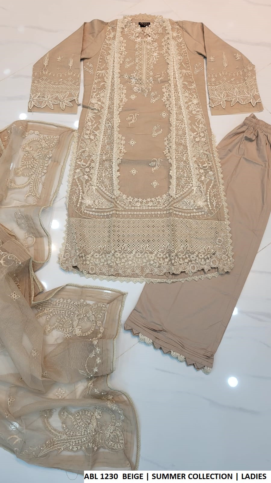 Pakistani women's beige khadi net A-Line shirt plazo outfit back view