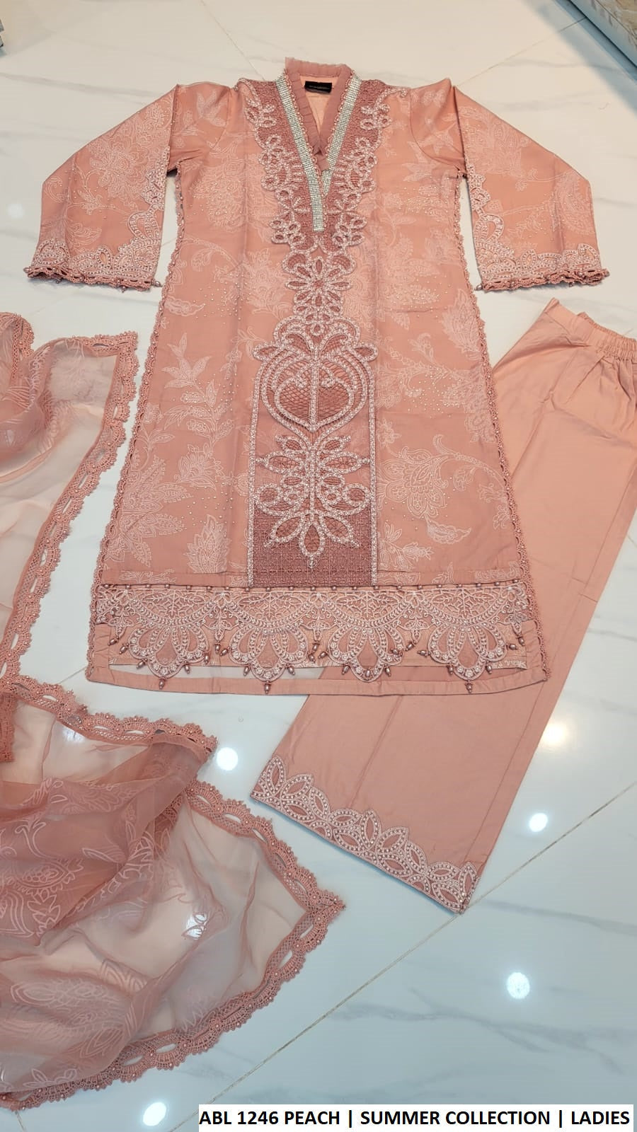 Pakistani women's peach organza straight shirt plazo outfit back view