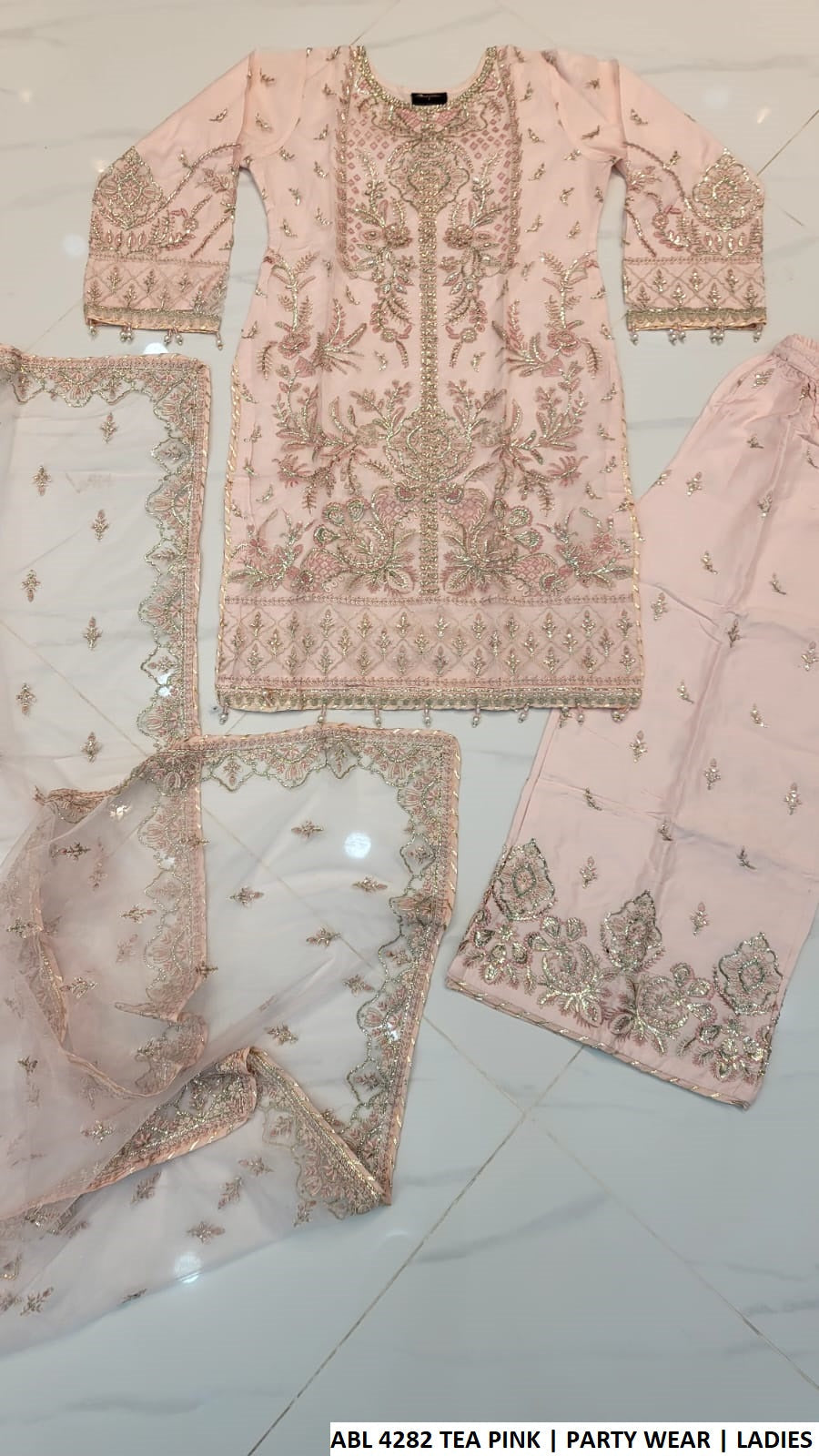 Pakistani women's tea pink net straight shirt plazo back view