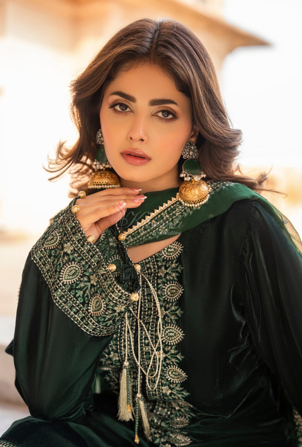 Pakistani women's bottle green velvet long kaftan plazo back view