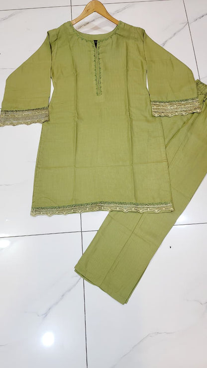 Pakistani women's pista green khaddar A-Line casual outfit back view