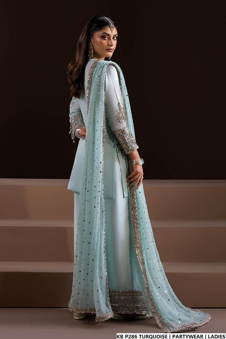 Pakistani women's turquoise hand embroidered luxury suit detail view