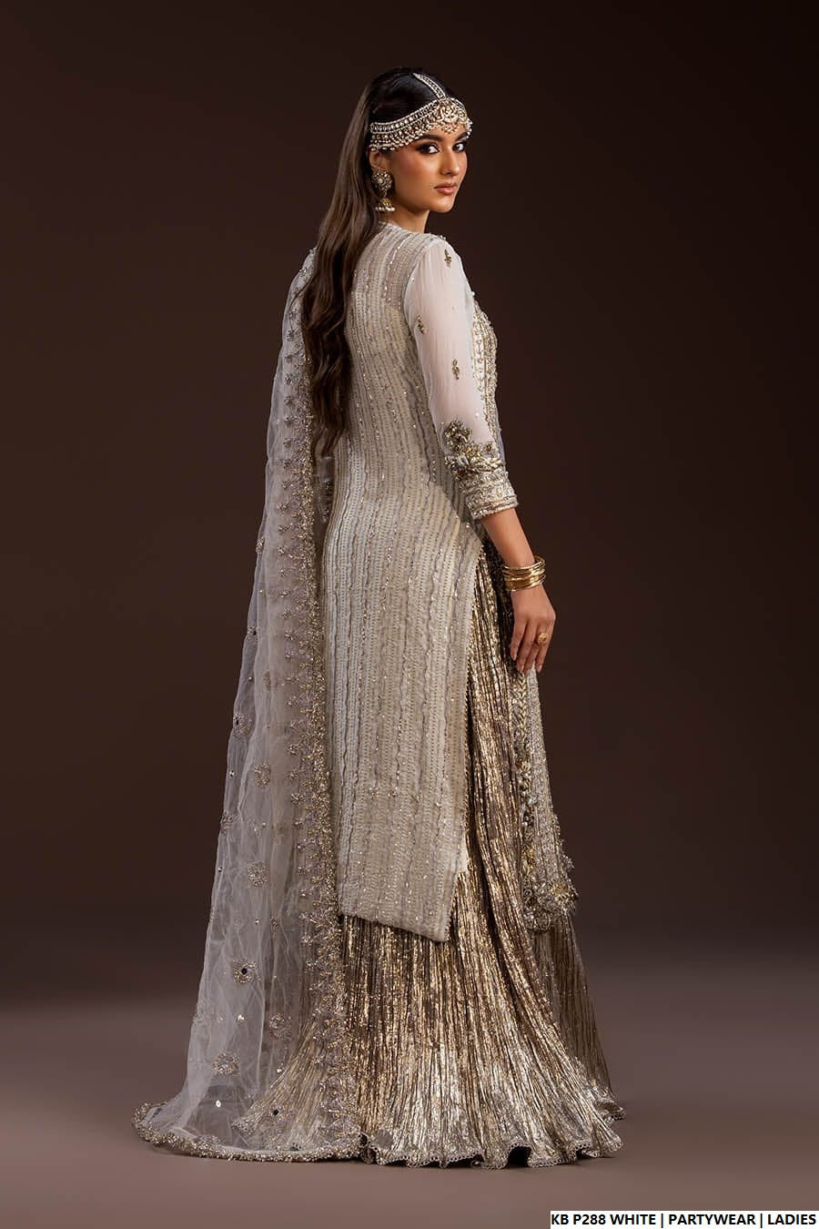 Pakistani women's white velvet embroidered suit detail view