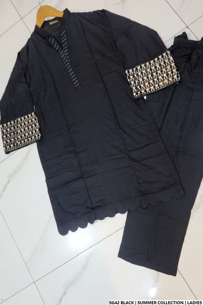 Pakistani women's black white lawn A-Line casual outfit back view