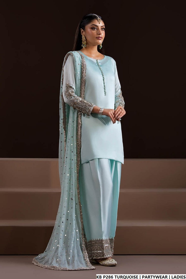 Pakistani women's turquoise hand embroidered luxury suit back view